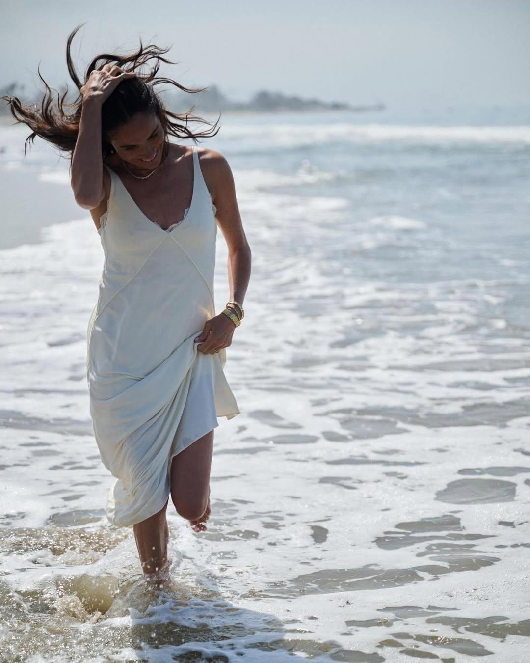 'Excited' Meghan Markle Sizzles In A White Slip Dress In New Pic Of Her Running On The Beach